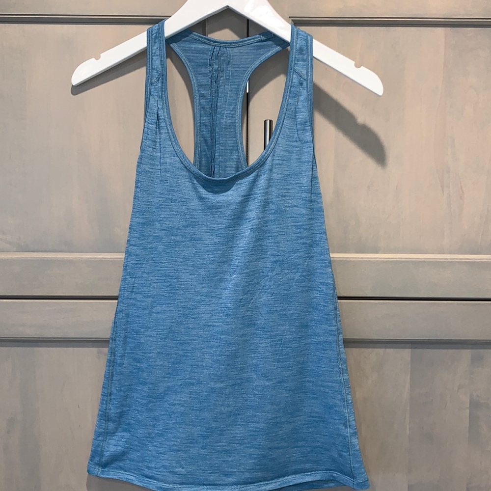 Lululemon Teal top, unstinkable technology, dryfit, very flattering fit for all